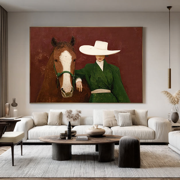 Living room with a large painting of a woman in a green coat and white hat standing next to a horse.