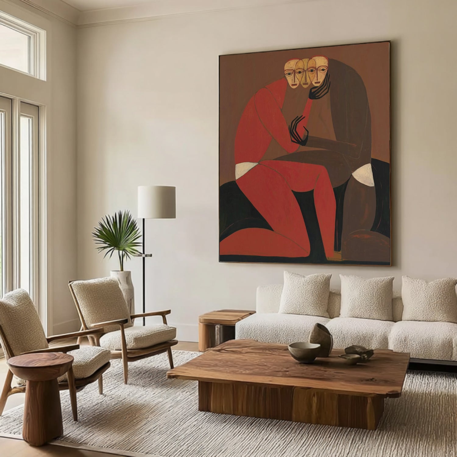Modern living room with a large abstract painting, sofa, chairs, and coffee table.