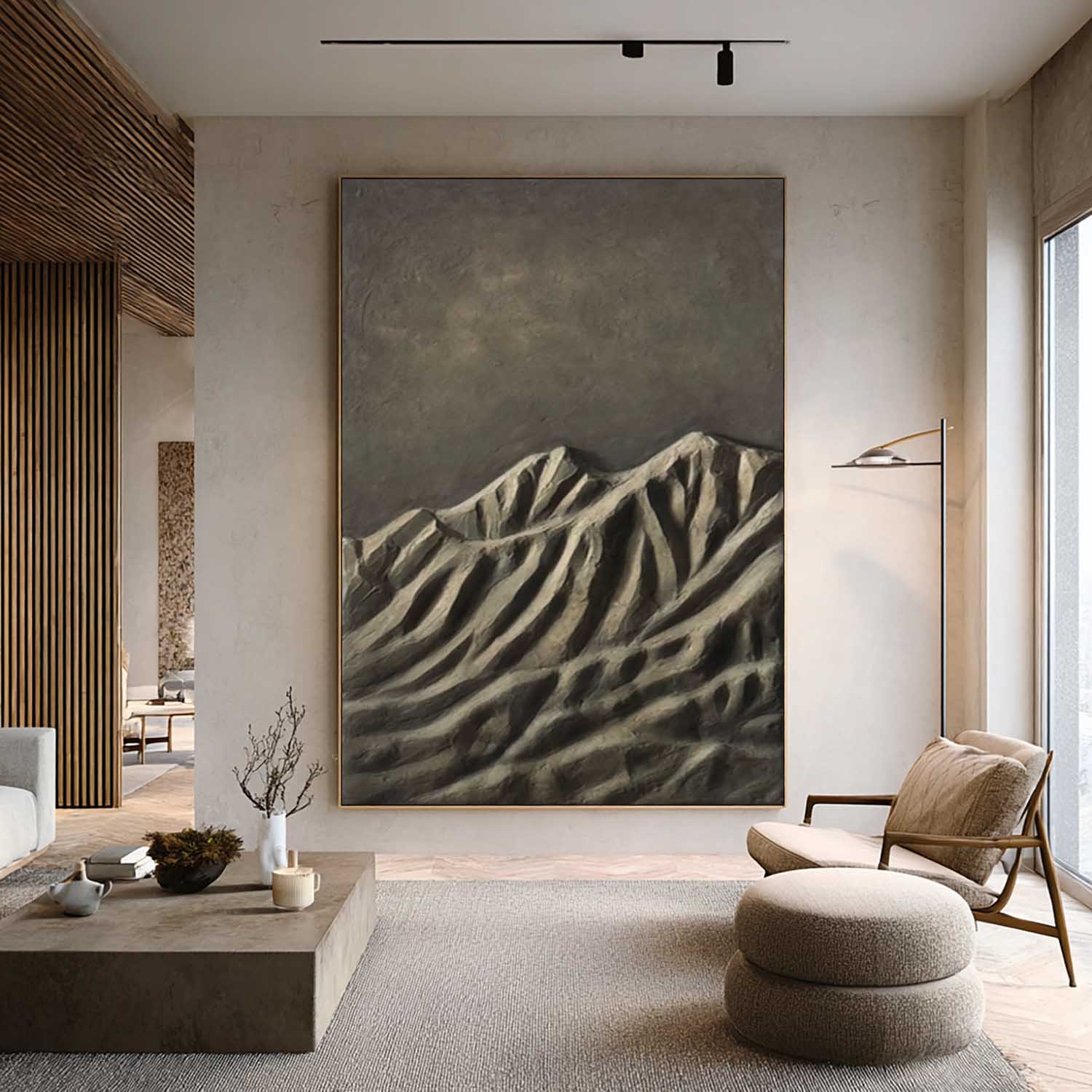 Modern living room with a large abstract mountain painting on the wall.