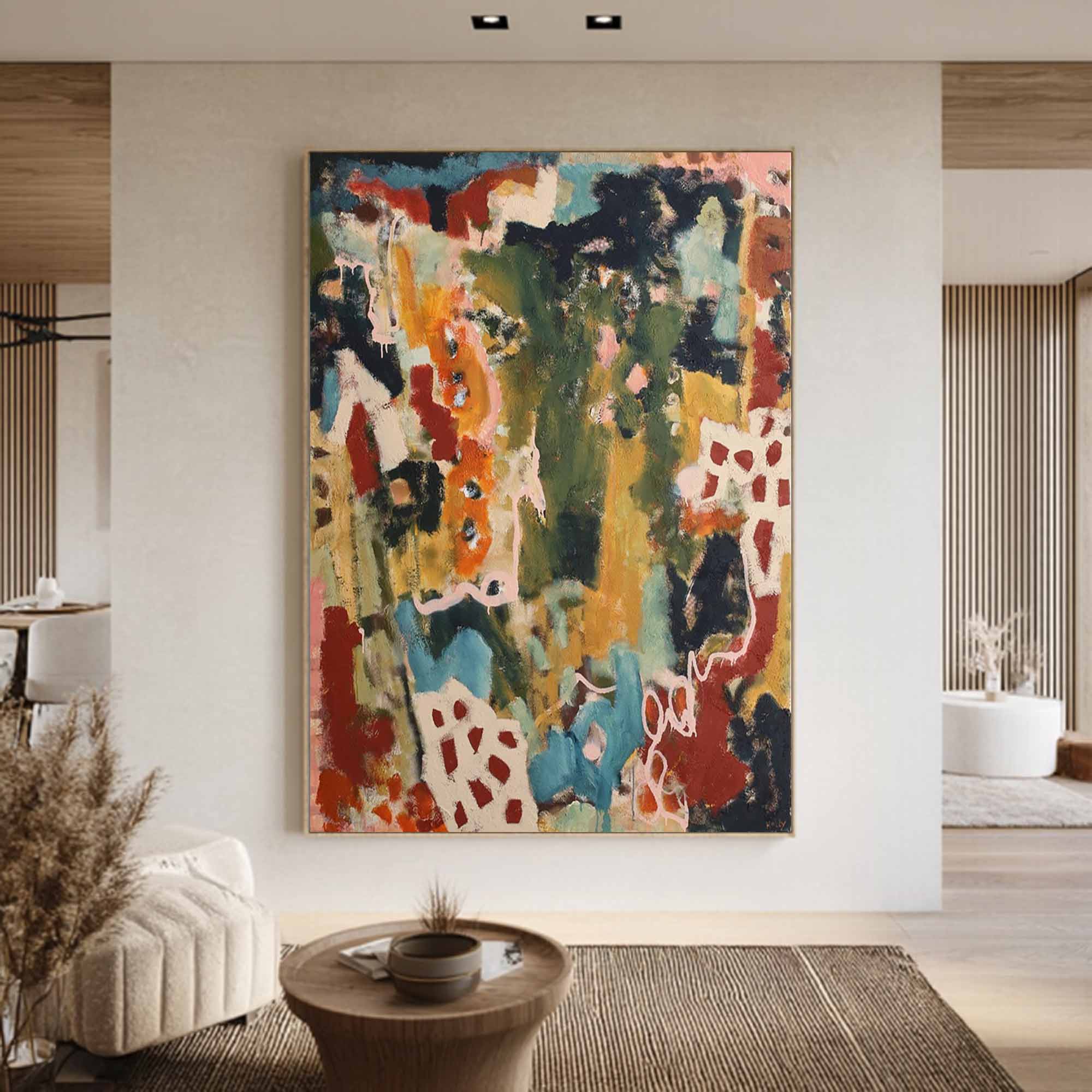 Abstract colorful painting on a wall in a modern living room.