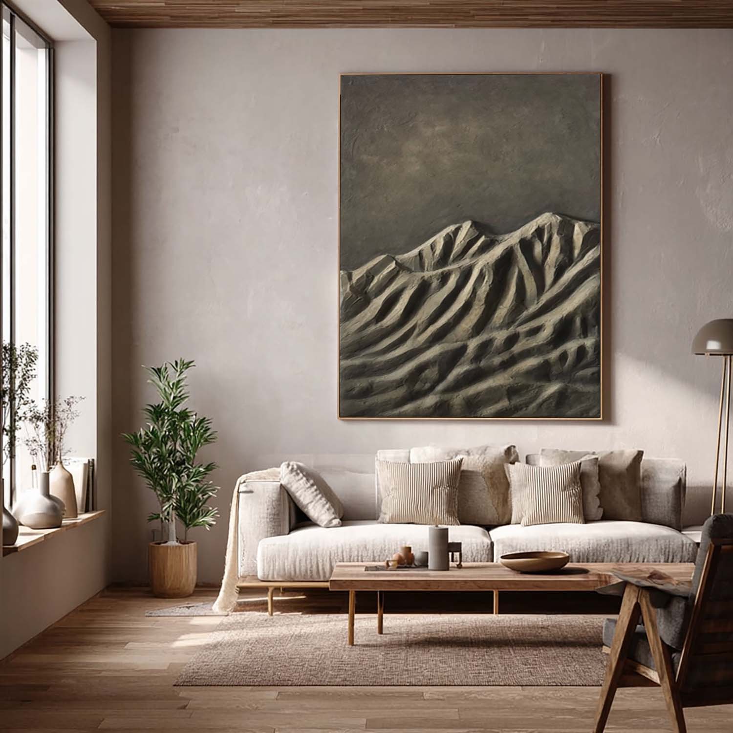 Living room with a large mountain painting on the wall, a sofa, and decorative items.